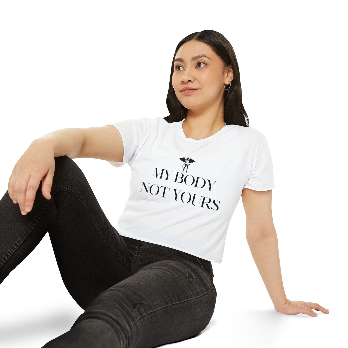 Woman wearing a white t-shirt with Donny's Devil 'My Body Not Yours' text sitting on a white background